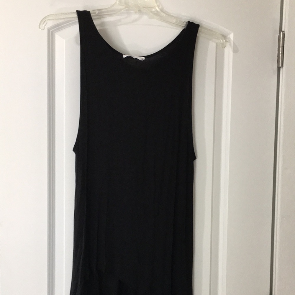 Black tank with curved hem.